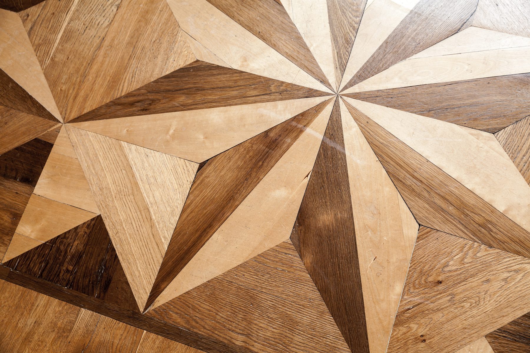 Decorative hardwood parquet flooring detail from a Berton & Acker remodel