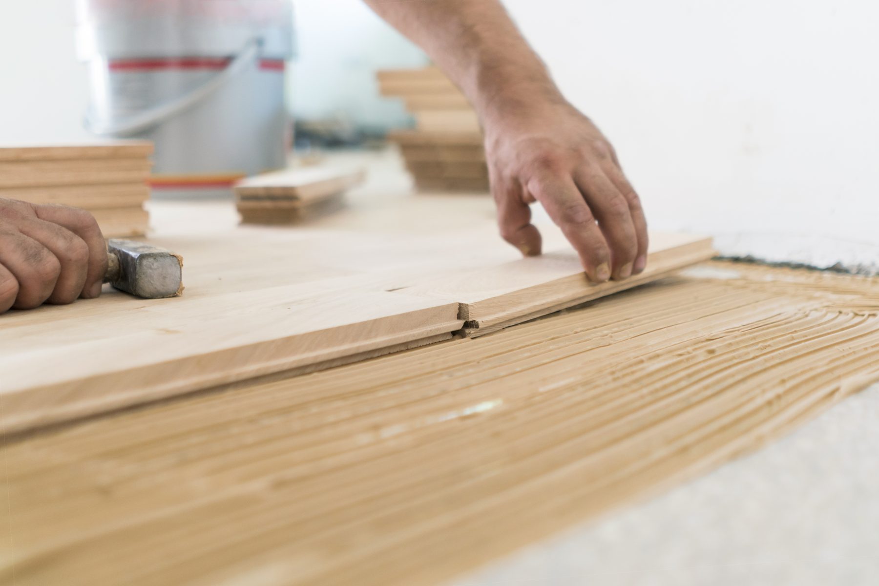 Close-up of hardwood plank installation in progress